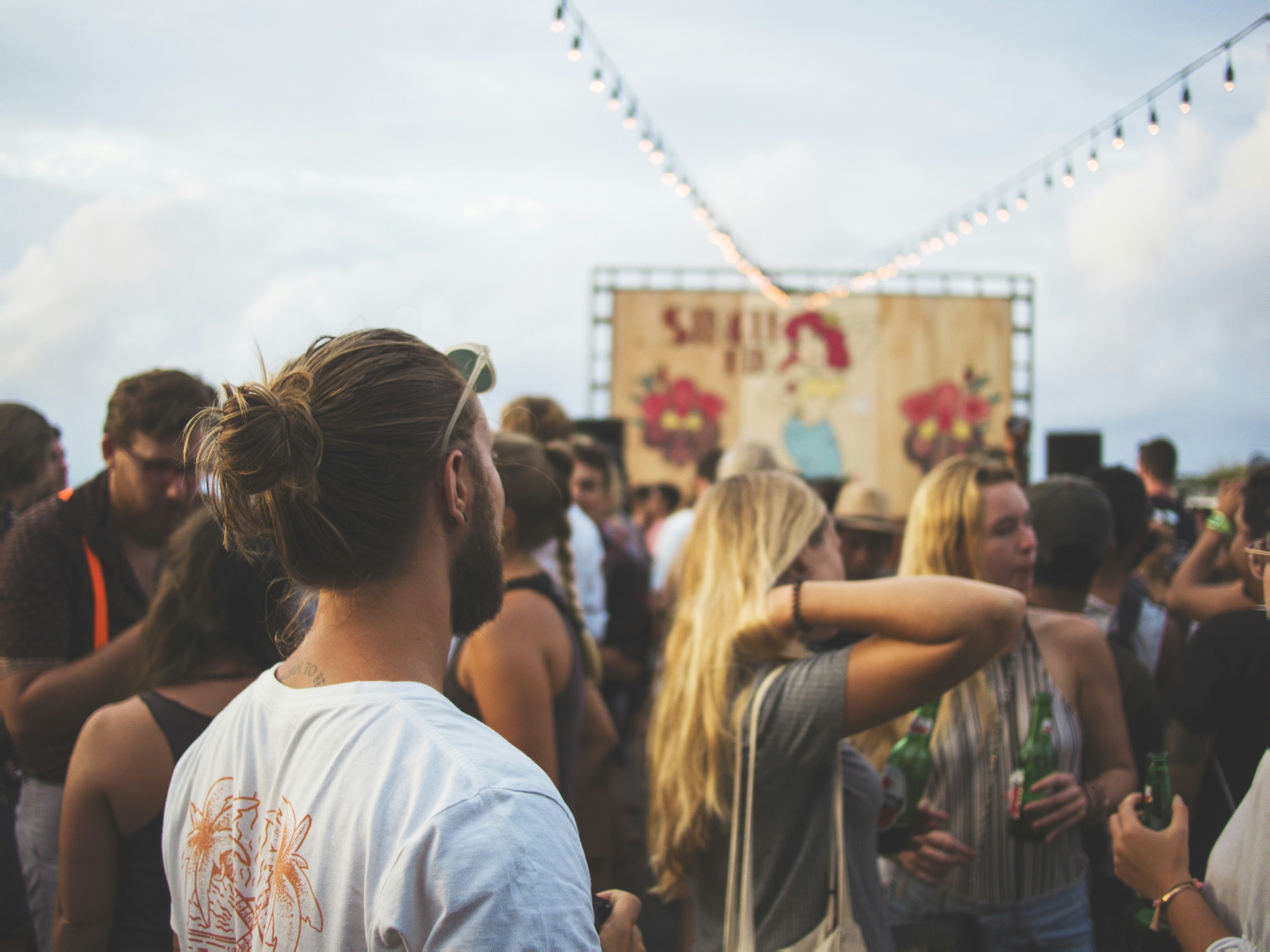 Crowd gathered at an outdoor beach festival